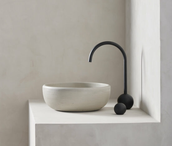 large round bowl sink rove in a micro cement minimalist bathroom in the colour bone with black hardware - photo is shot in side view