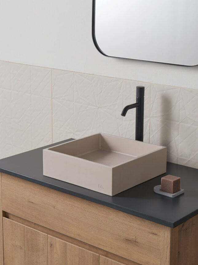 mudd concrete Yarra sm in the colour mocha in a modern light bathroom setting with black hardware