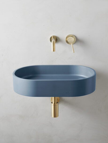 parro lg affix in denim on a minimalist backdrop with gold hardware