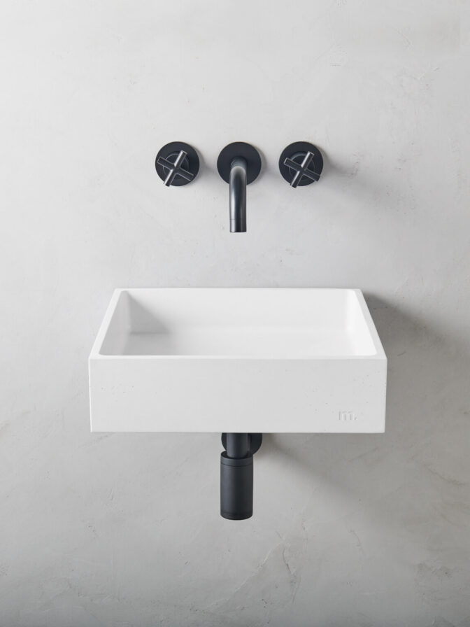 mudd concrete Yarra LG Affix in the colour cotton in a microcement bathroom setting with black hardware