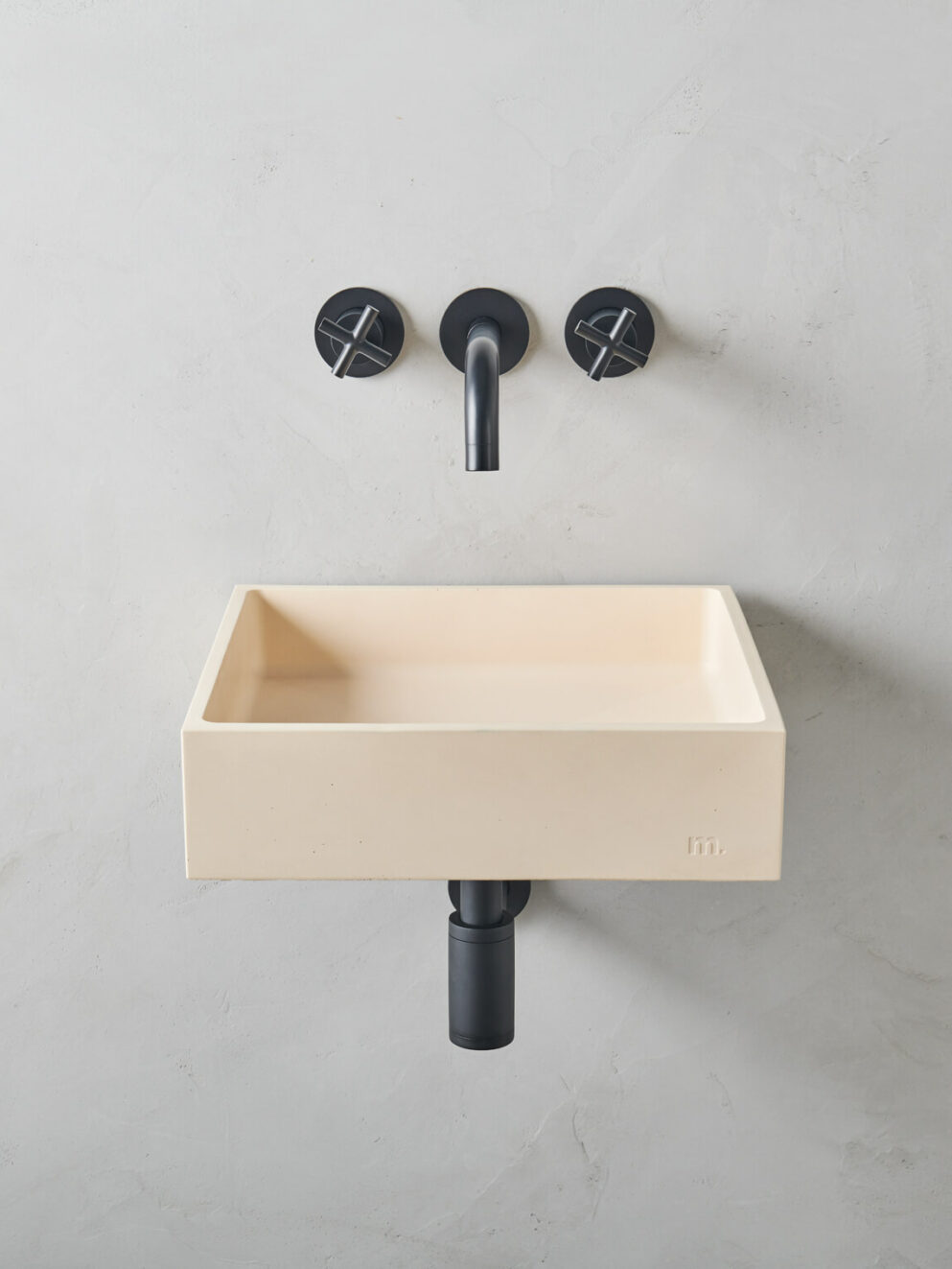 mudd concrete Yarra LG Affix in the colour peache in a microcement bathroom setting with black hardware